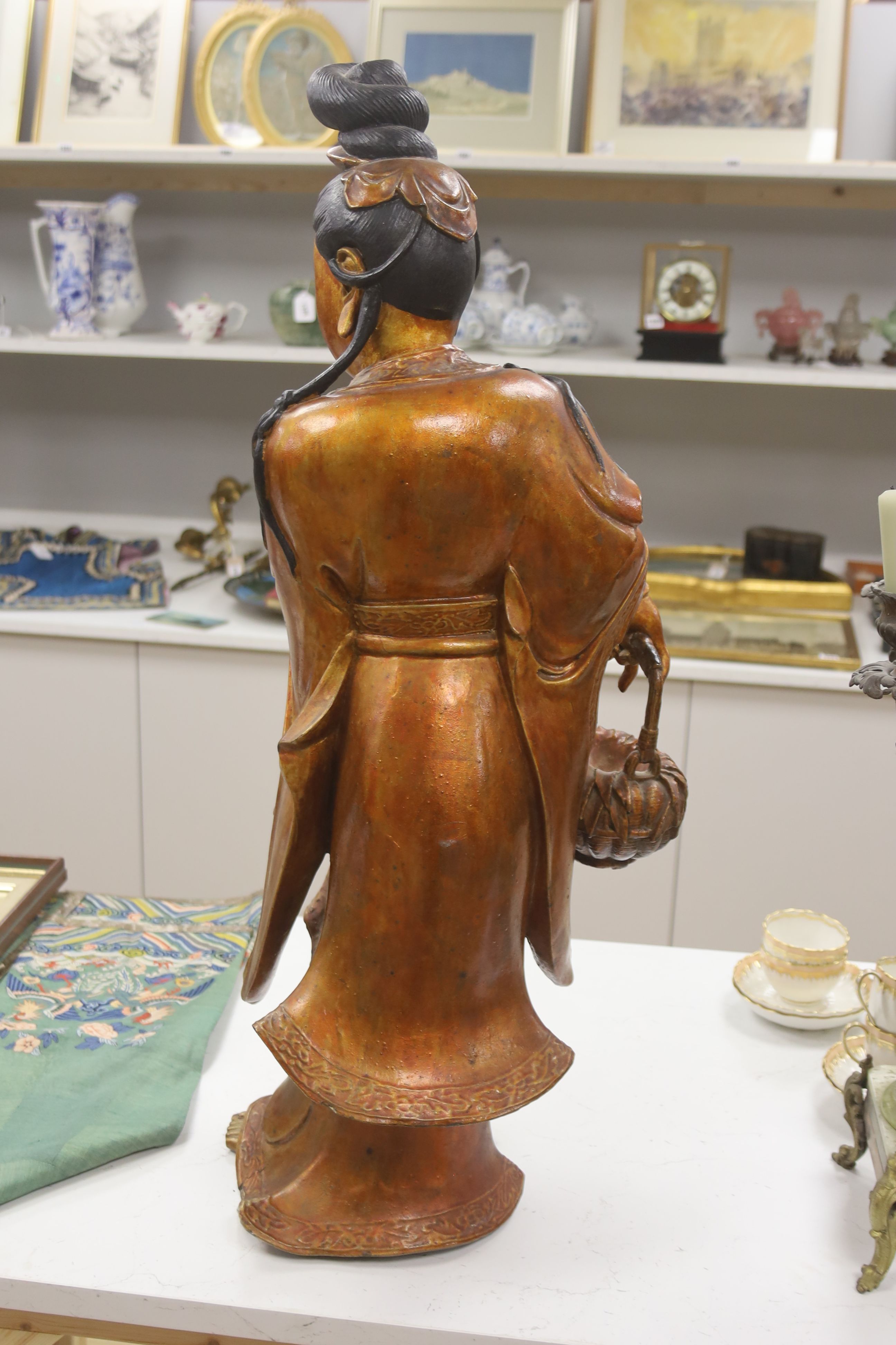 A large Chinese giltwood figure of a lady, height 59cm